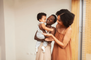 lesbian couple holding their baby after couples counseling in simi valley